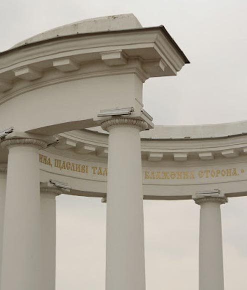 A structure that looks like a horseshoe painted in white